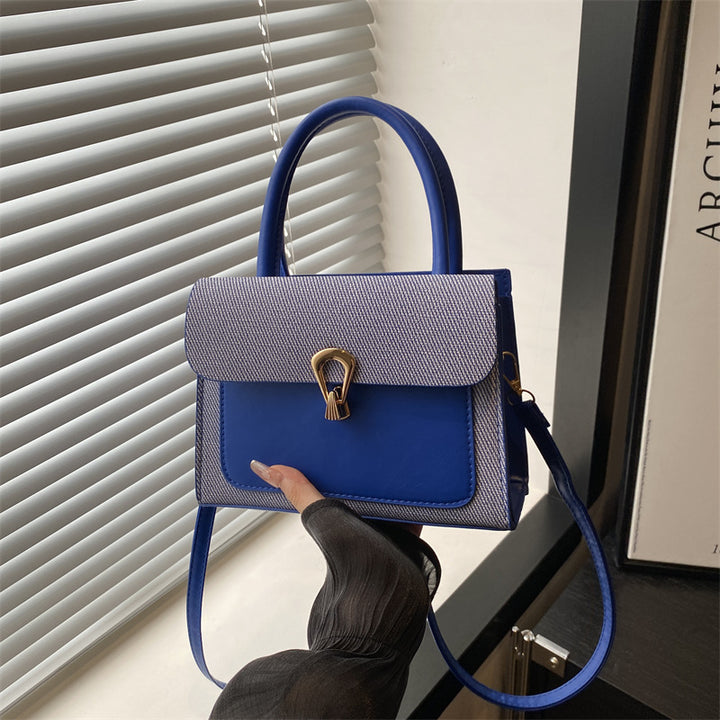 Damen elegante Umhängetasche mit strukturiertem Obermaterial und goldfarbener Verschlussmechanik Nord Taschen