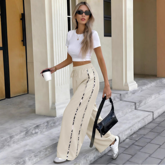 Damen Weite High‑Waist Loungehose mit Kordelzug und kontrastierenden Seitenstreifen Nord Taschen