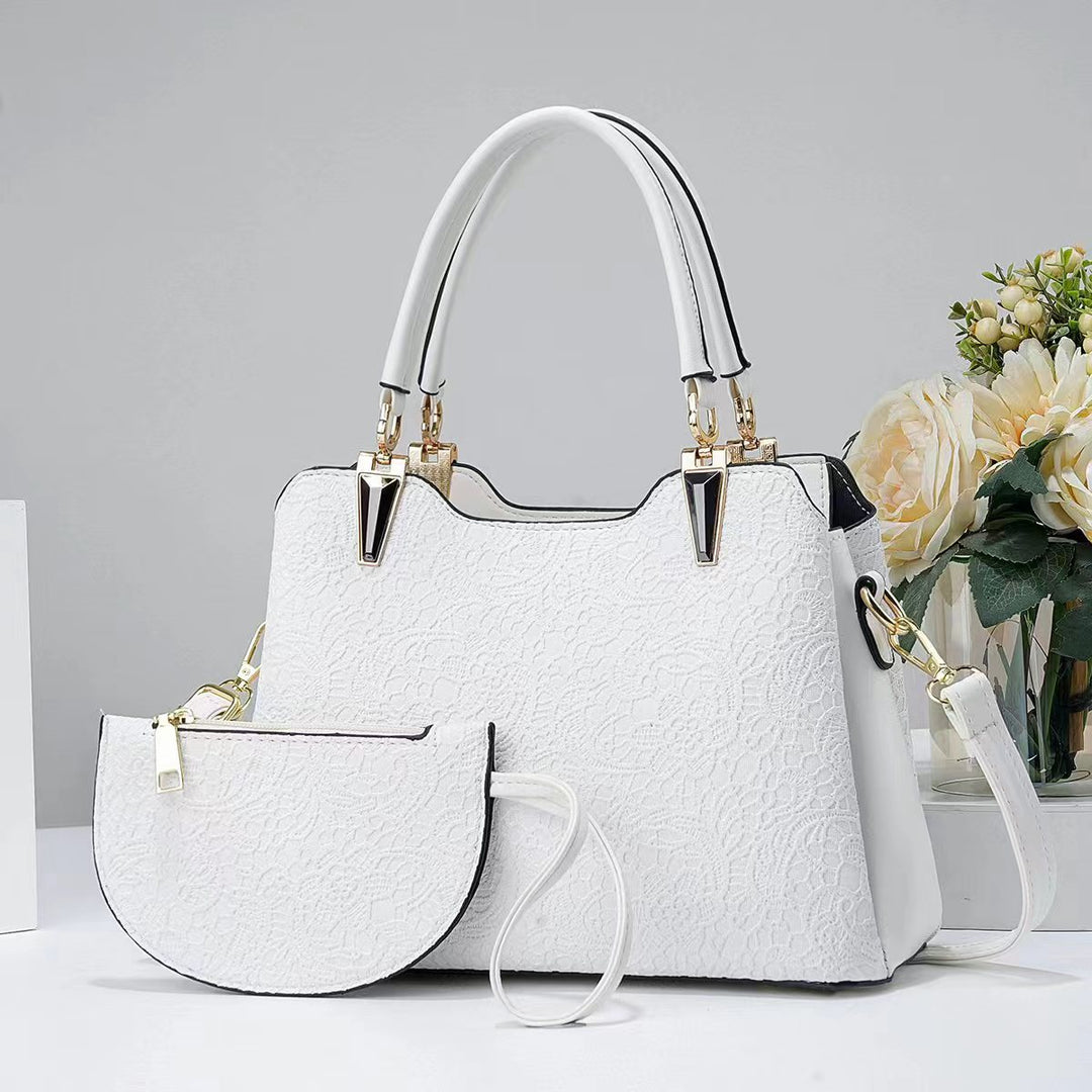 Damen elegante Handtasche mit filigranem Spitzenmuster und abnehmbarer Clutch Nord Taschen