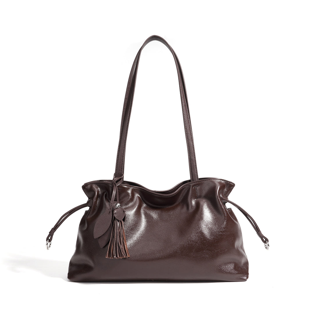 Damen Handtasche aus hochwertigem Kunstleder mit auffälligem Quastenanhänger Nord Taschen