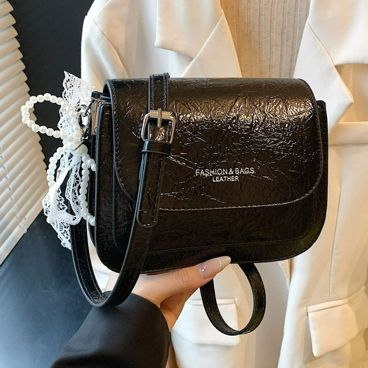 Damen Umhängetasche mit charmantem Spitzen- und Perlenanhänger Nord Taschen