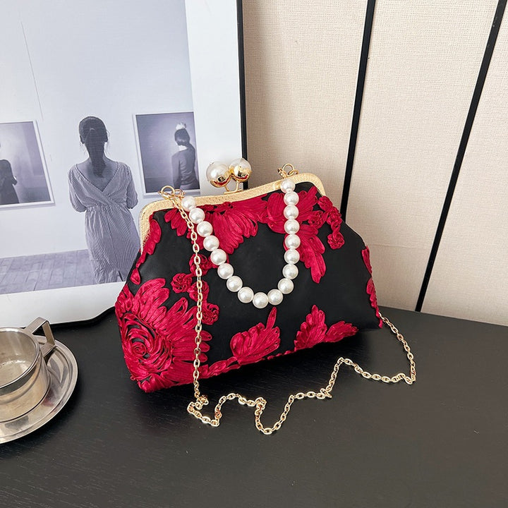 Damen elegante Clutch mit floralen Stickereien und Perlenakzenten Nord Taschen