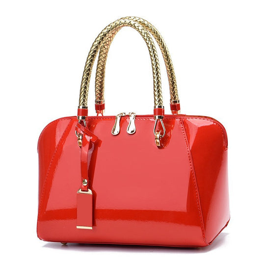 Damen Handtasche mit glänzender Oberfläche und eleganten Geflochtenen Griffen Nord Taschen
