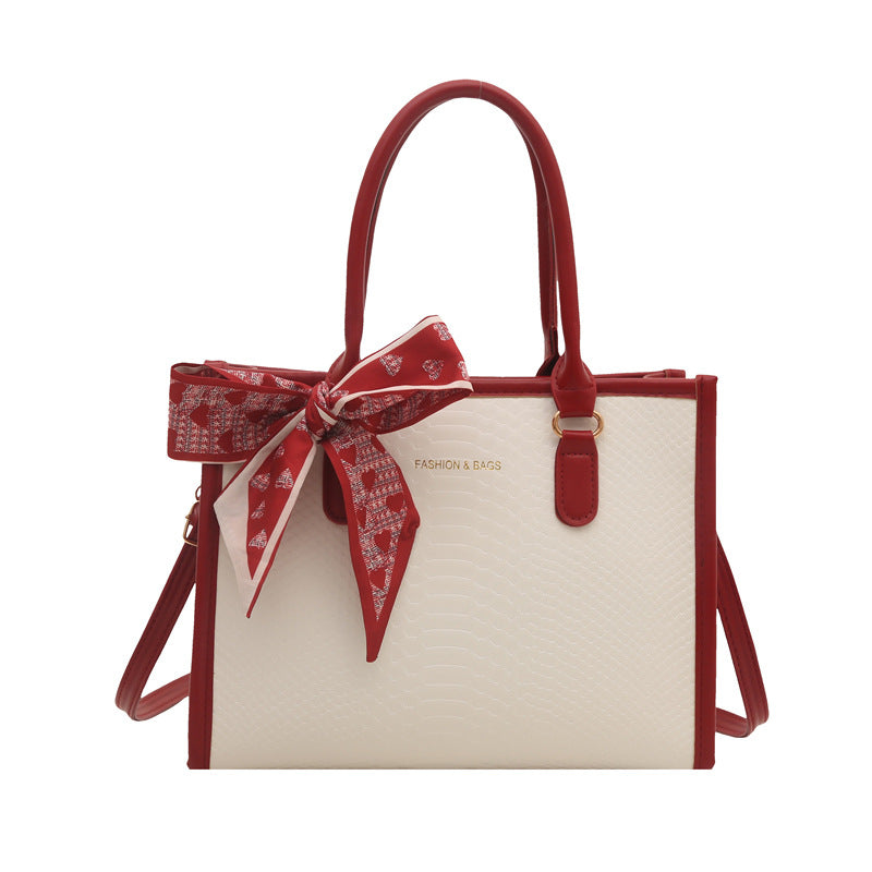Damen stilvolle Handtasche mit geflochtenem Design und dekorativem Schleifenband Nord Taschen