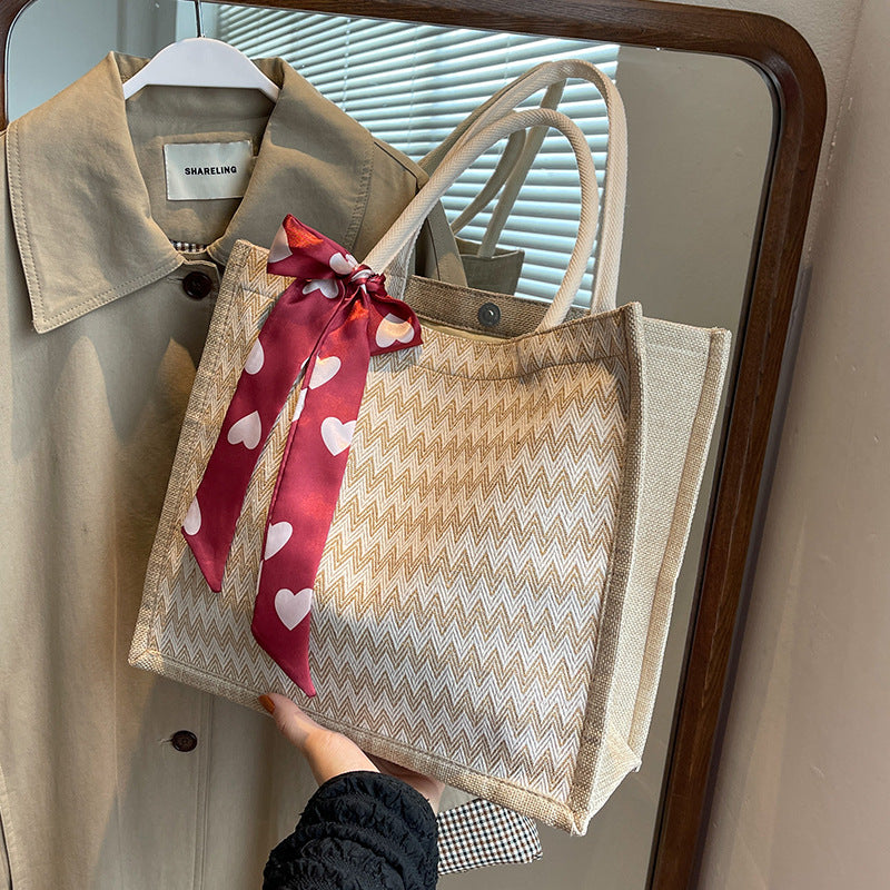 Damen Jute-Shopper mit modernem Wellenmuster und dekorativem Schleifenakzent Nord Taschen