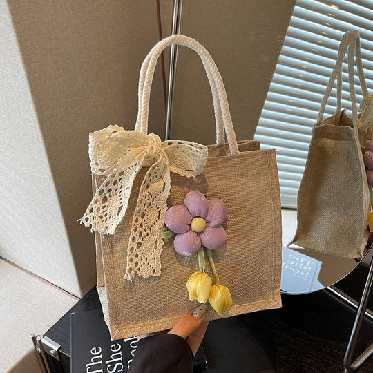 Damen Jute-Handtasche mit floralen Applikationen und dekorativem Schleifen-Design Nord Taschen
