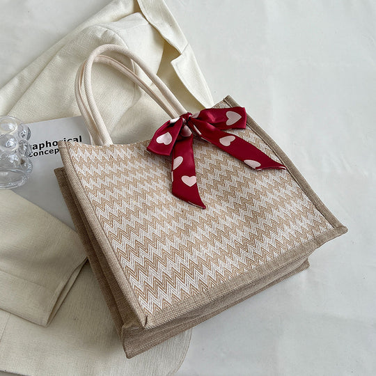 Damen Jute-Shopper mit modernem Wellenmuster und dekorativem Schleifenakzent Nord Taschen