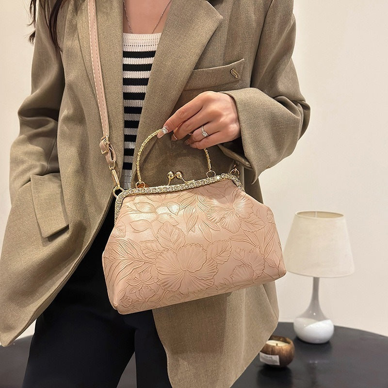 Damen elegante Handtasche mit floralem Relief und goldenen Akzenten Nord Taschen