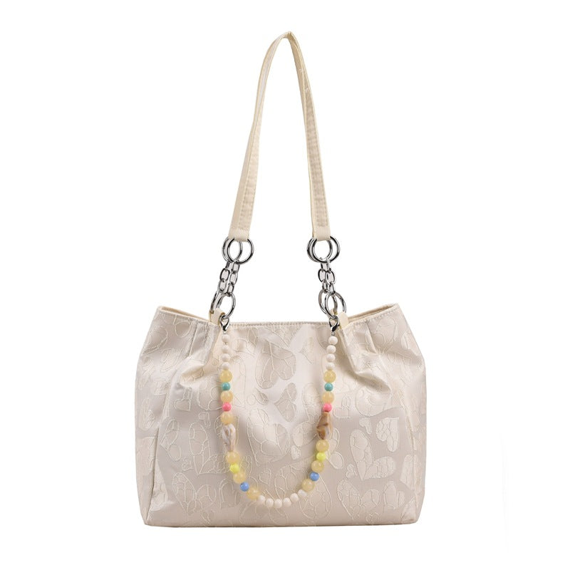 Damen modische Handtasche mit Herzprägung und buntem Anhänger Nord Taschen