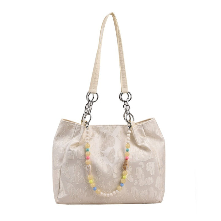 Damen modische Handtasche mit Herzprägung und buntem Anhänger Nord Taschen