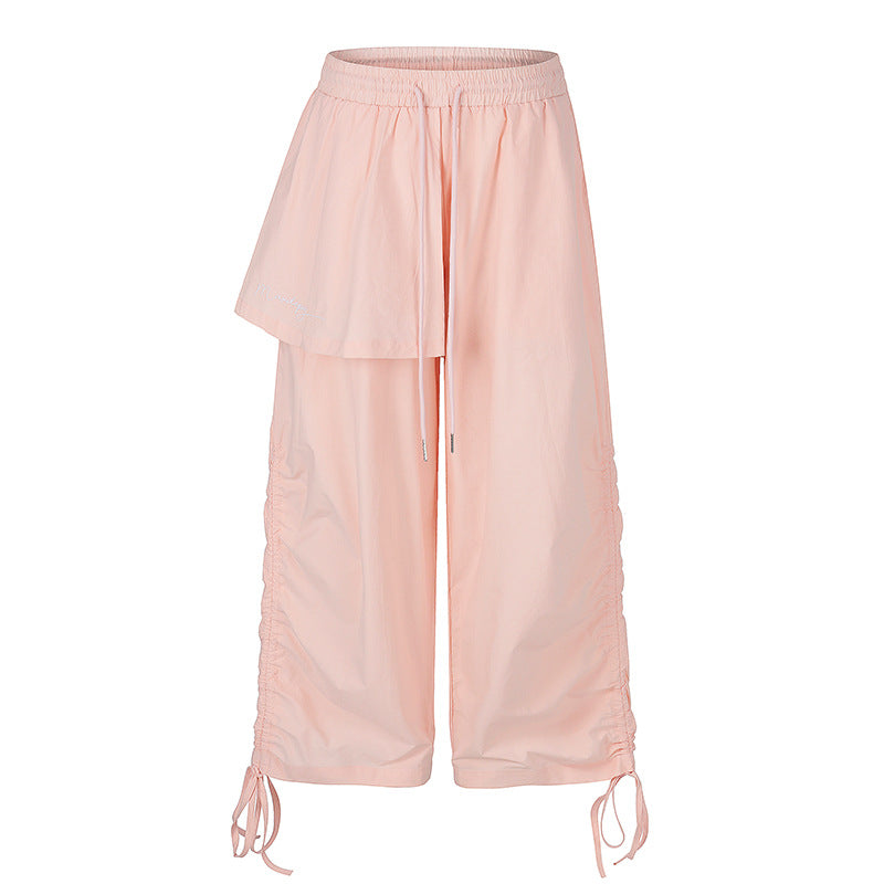 Damen Weite Capri-Hose mit Tunnelzug, seitlicher Raffung und asymmetrischer Überlagerung Nord Taschen