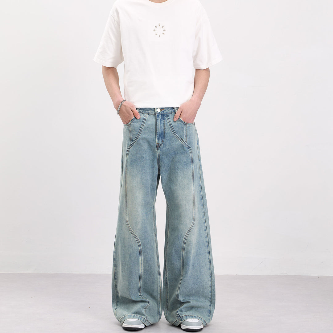 Herren Weit geschnittene Denim-Palazzohose mit geschwungenen Nahtpaneelen und extralangem Saum Nord Taschen