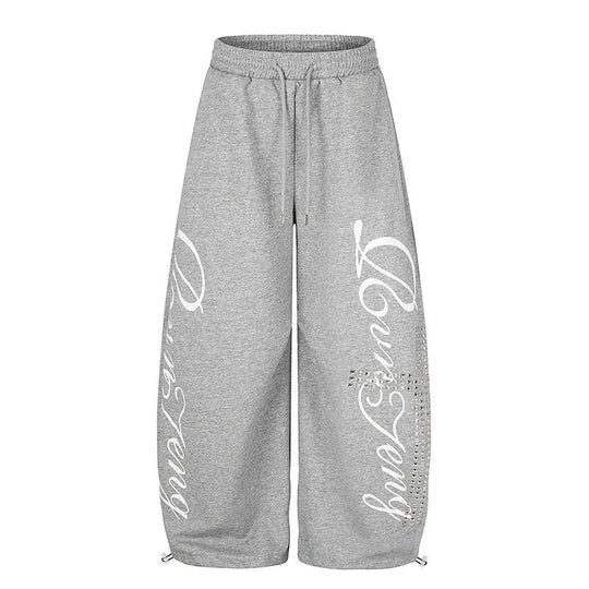 Damen Palazzo-Sweatpants im Culotte-Stil mit hohem Bund, Tunnelzug, Schriftprint und Strassbesatz Nord Taschen