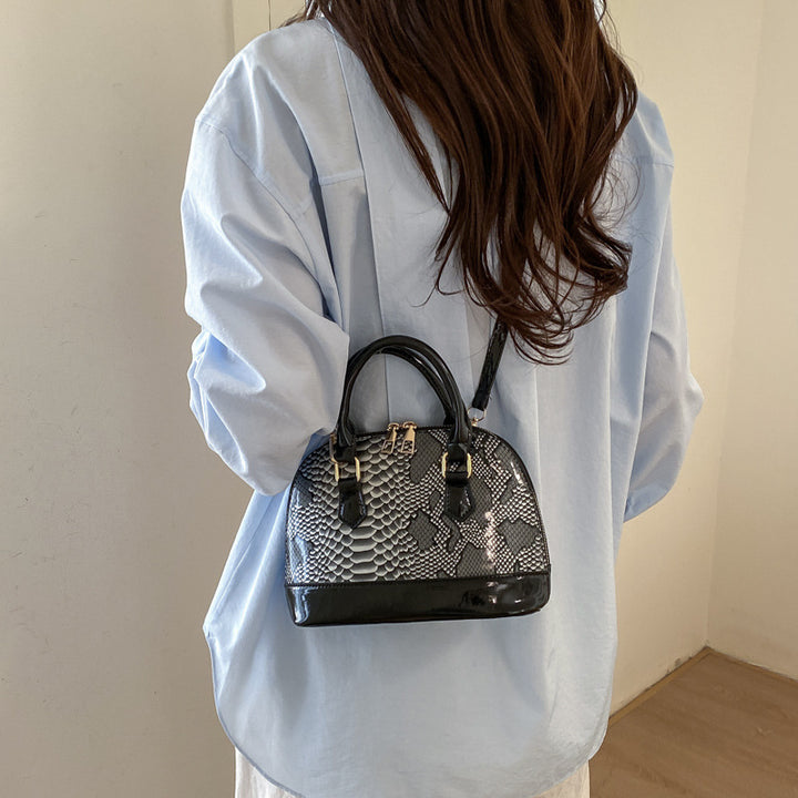Damen elegante Handtasche im stilvollen Schlangenleder-Look Nord Taschen