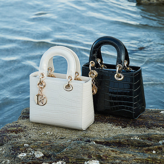 Damen Handtasche im eleganten Krokodil-Look mit goldenen Akzenten Nord Taschen