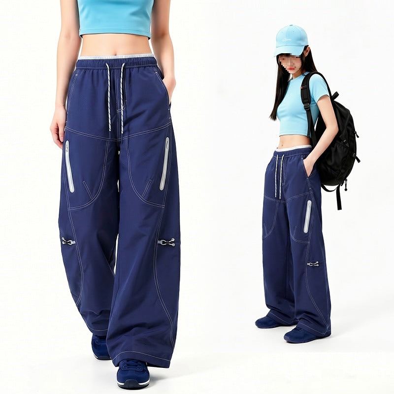 Damen Oversize Tech-Loungehose mit Kontrastnähten, reflektierenden Reißverschlusstaschen & Kordelbund Nord Taschen