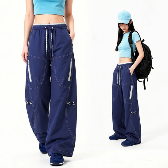 Damen Oversize Tech-Loungehose mit Kontrastnähten, reflektierenden Reißverschlusstaschen & Kordelbund Nord Taschen