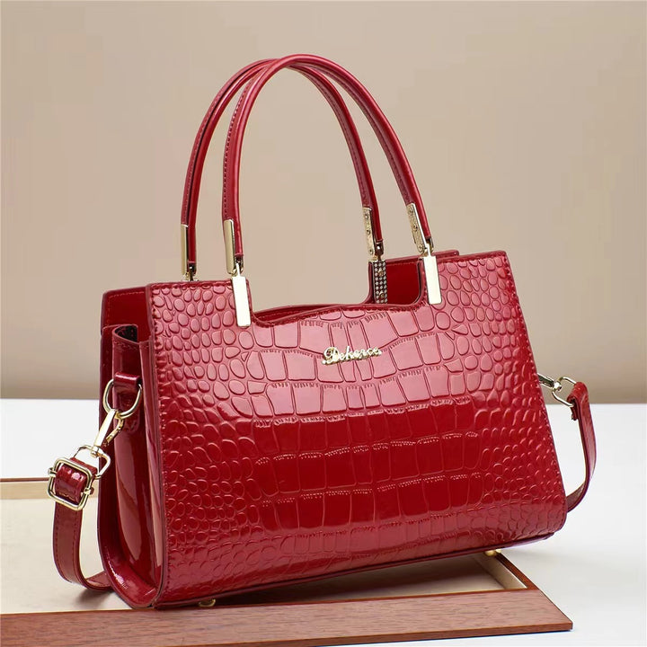 Damen Handtasche mit glänzender Krokodilprägung und abnehmbarem Tragegurt Nord Taschen