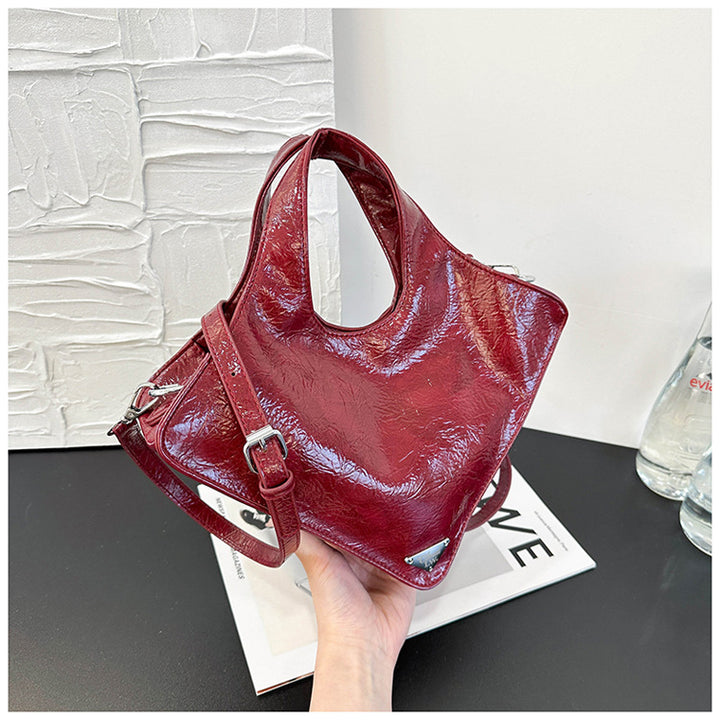 Damen stilvolle Handtasche aus glänzendem Kunstleder Nord Taschen