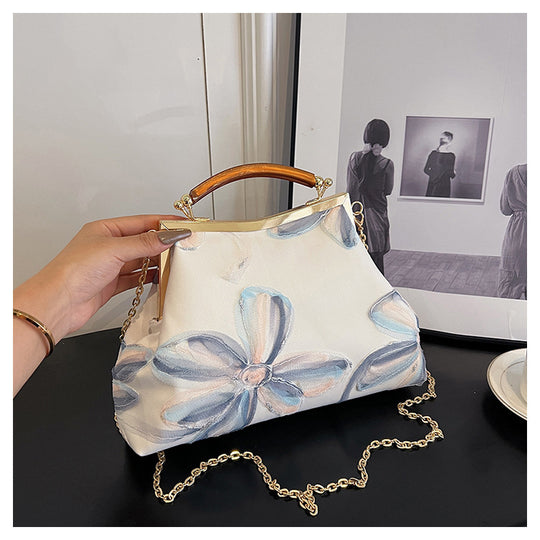 Damen Handtasche mit floralem Muster und elegantem Kettenakkzent Nord Taschen