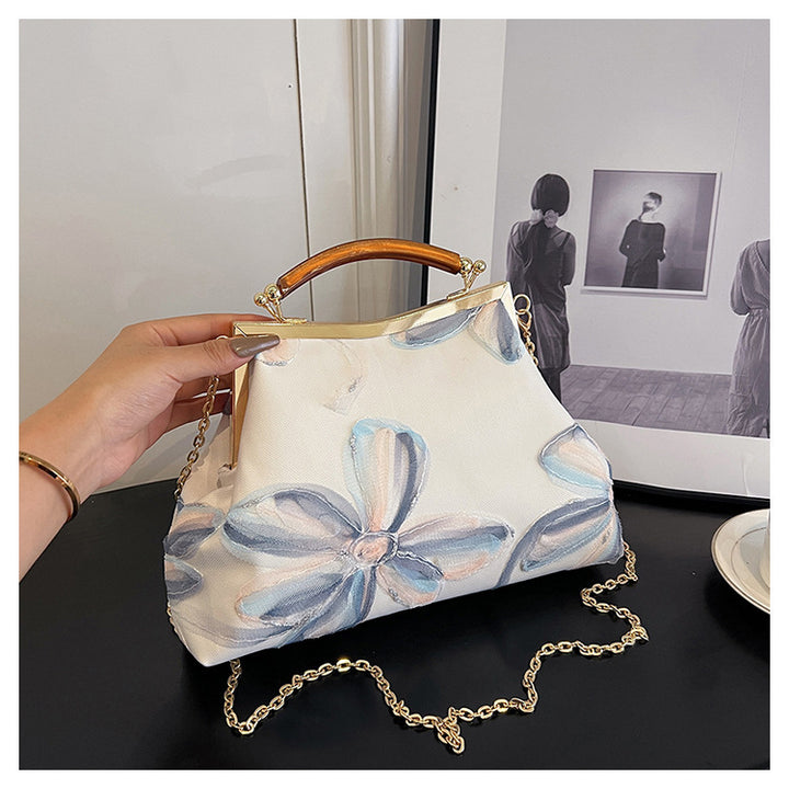 Damen Handtasche mit floralem Muster und elegantem Kettenakkzent Nord Taschen