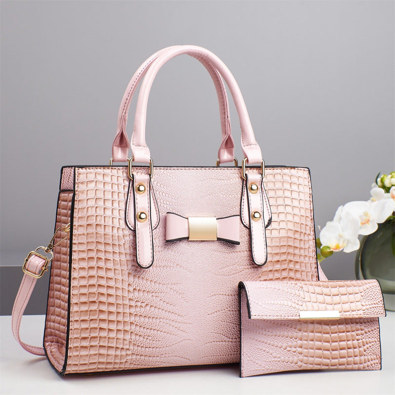 Damen elegante Handtasche mit schicker Schleifenapplikation und edlem Krokodil-Look Nord Taschen
