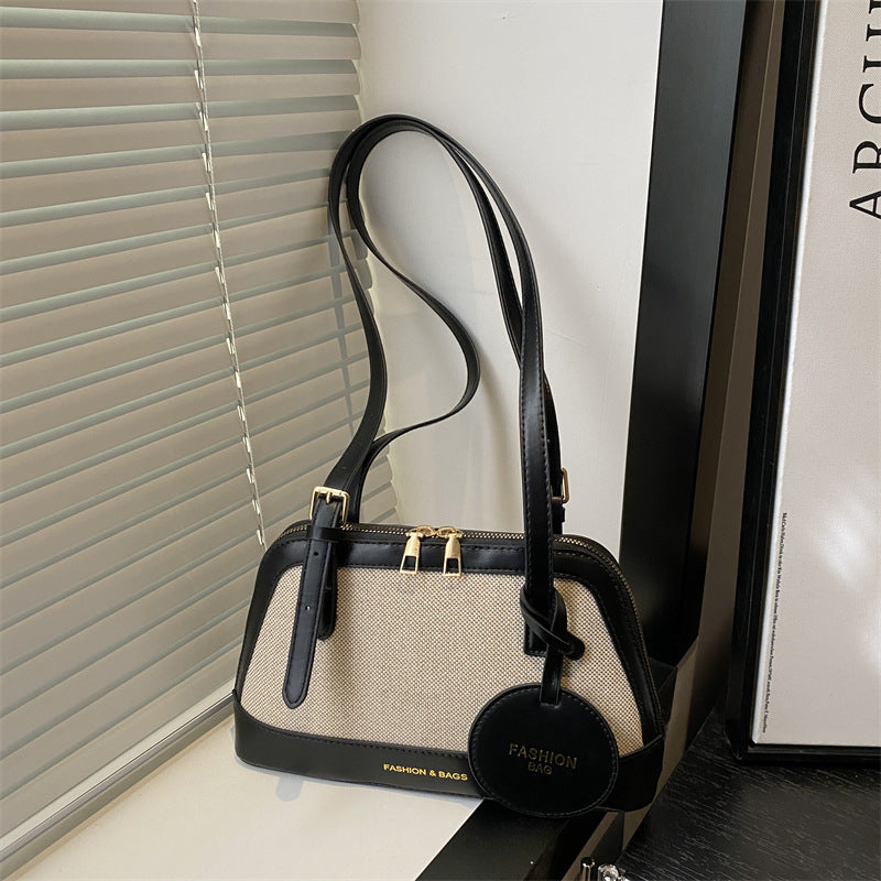 Damen Umhängetasche mit strukturiertem Gewebe und elegantem Detail Nord Taschen
