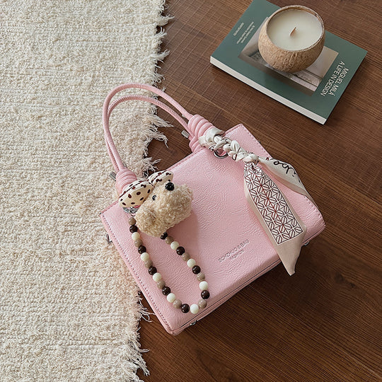 Damen Handtasche mit integriertem Tragegurt und geflochtenen Details Nord Taschen