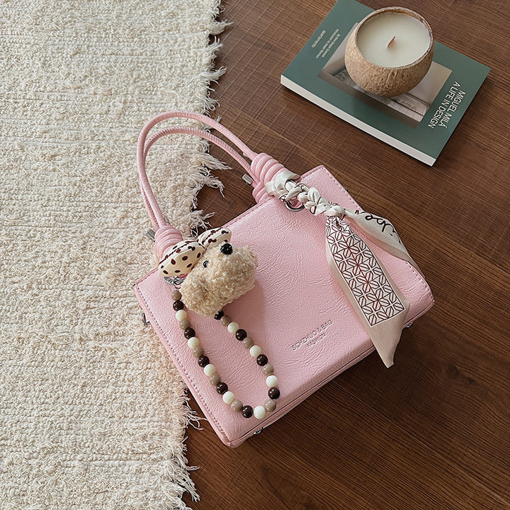 Damen Handtasche mit integriertem Tragegurt und geflochtenen Details Nord Taschen