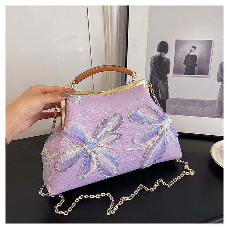 Damen Handtasche mit floralem Muster und elegantem Kettenakkzent Nord Taschen
