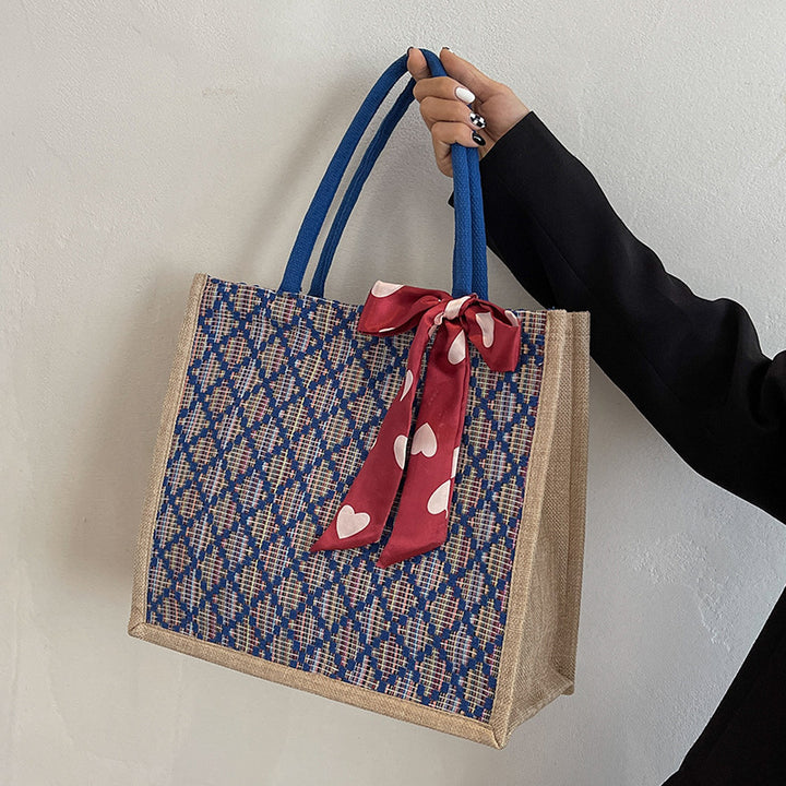 Damen Jute-Einkaufstasche mit buntem Grafikdesign und dekorativem Schleifenakzent Nord Taschen