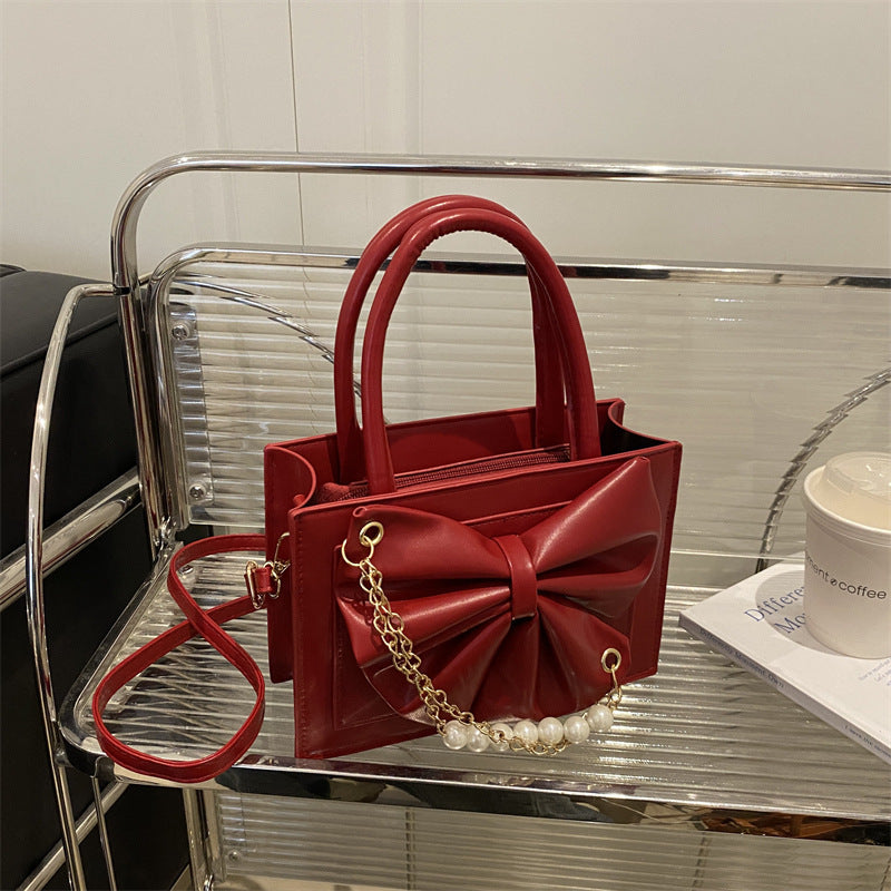 Damen elegante Handtasche mit Schleifenakzent und Perlenverzierung Nord Taschen