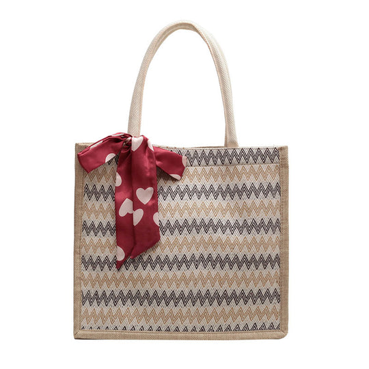 Damen Jute-Shopper mit modernem Wellenmuster und dekorativem Schleifenakzent Nord Taschen
