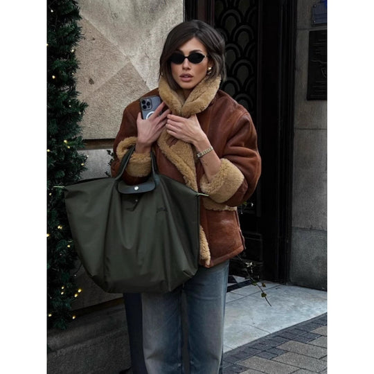 Damen Oversize Lammfell‑Optik Fliegerjacke mit voluminösem Schalkragen Nord Taschen