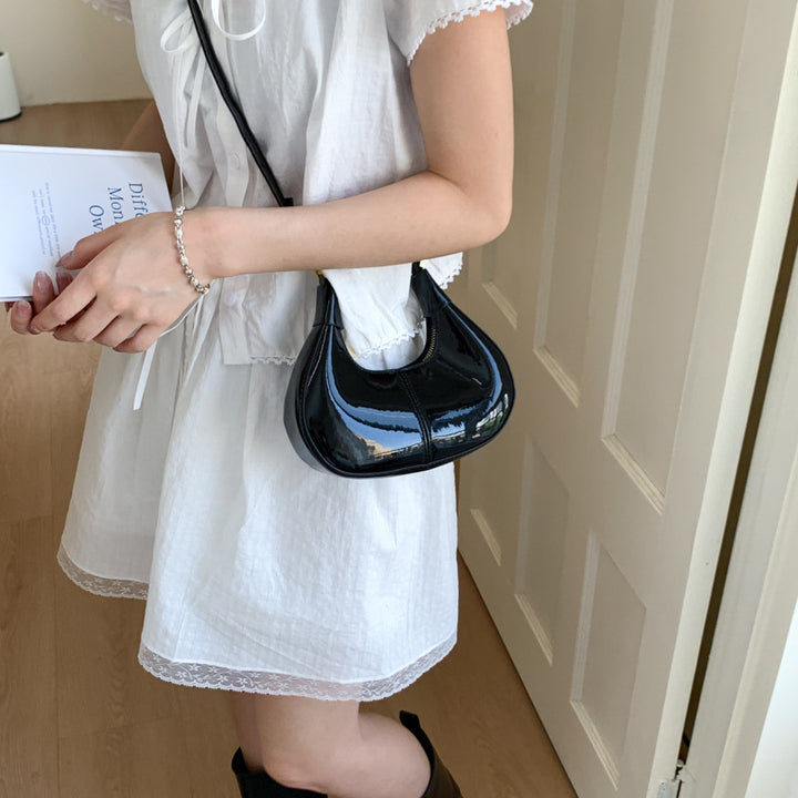 Damen elegante Handtasche mit glänzender Oberfläche und innovativem Verschluss Nord Taschen
