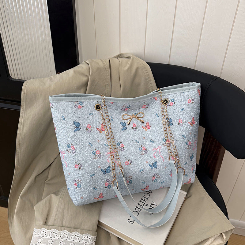 Damen Einkaufstasche mit floralem Design und elegantem Kettenakzent Nord Taschen