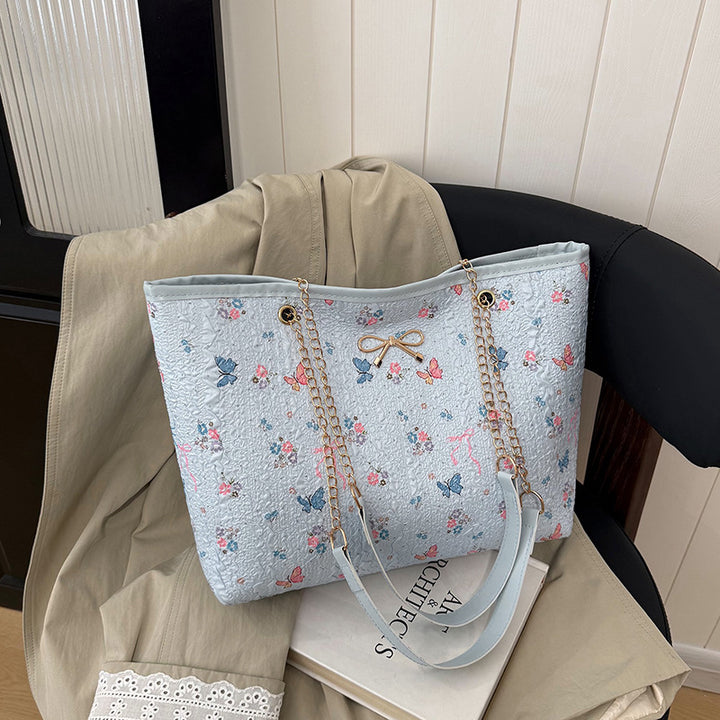 Damen Einkaufstasche mit floralem Design und elegantem Kettenakzent Nord Taschen