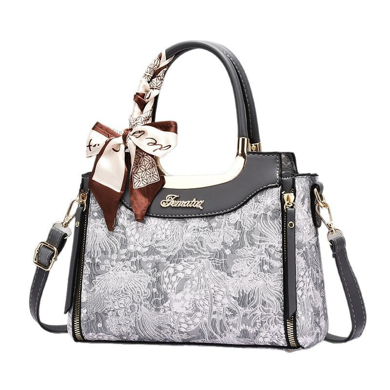Damen elegante Handtasche mit floralem Design und Schmuckdetails Nord Taschen