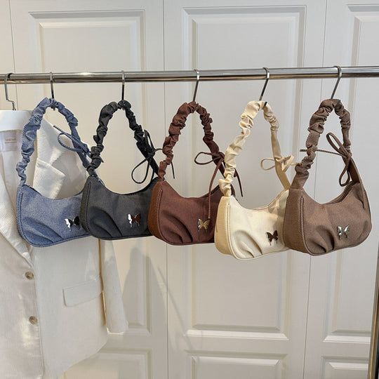 Damen Handtasche mit kreativer Faltentechnik und verspieltem Trageriemen Nord Taschen