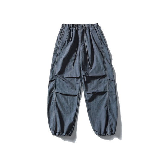 [Herren] weit geschnittene Nylon-Joggerhose im Utility-Stil mit Tunnelzugbund, Kontrastpaspel und elastischen Knöchelabschlüssen Nord Taschen