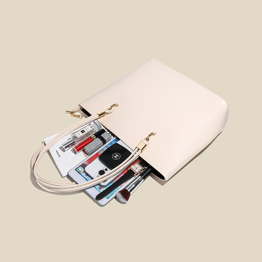 Damen Elegante Handtasche mit hochglänzender Oberfläche und goldenen Details Nord Taschen