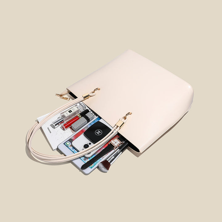 Damen Elegante Handtasche mit hochglänzender Oberfläche und goldenen Details Nord Taschen