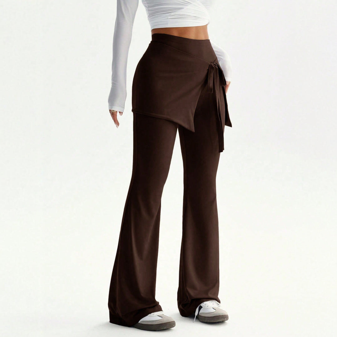 Damen hochtaillierte Schlaghose mit Wickelrock-Overlay und Taillenschleife Nord Taschen