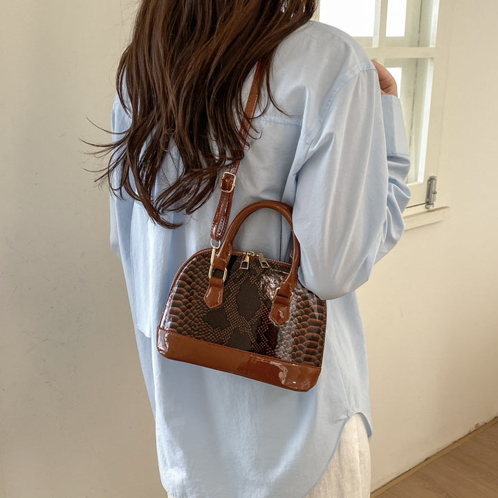 Damen elegante Handtasche im stilvollen Schlangenleder-Look Nord Taschen