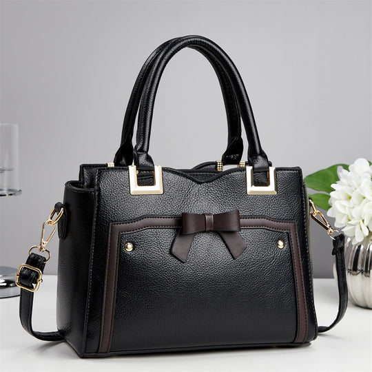 Damen elegante Handtasche mit schimmerndem Schleifendetail und abnehmbarem Schulterriemen Nord Taschen