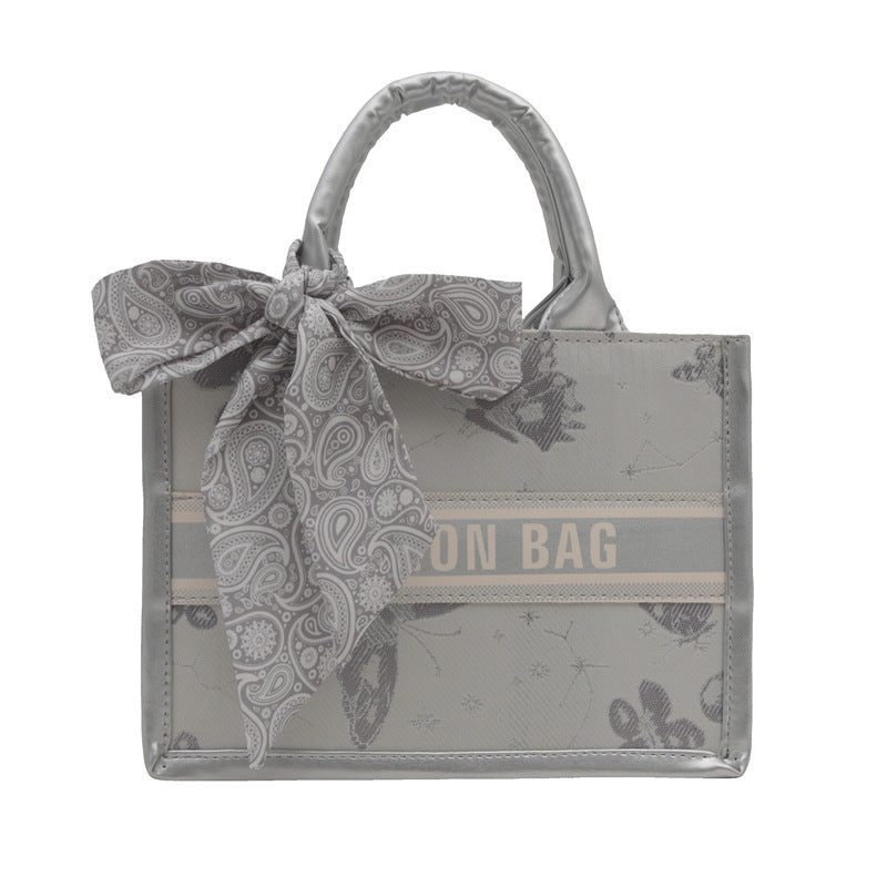 Damen Handtasche im eleganten Design mit dekorativem Schal Nord Taschen