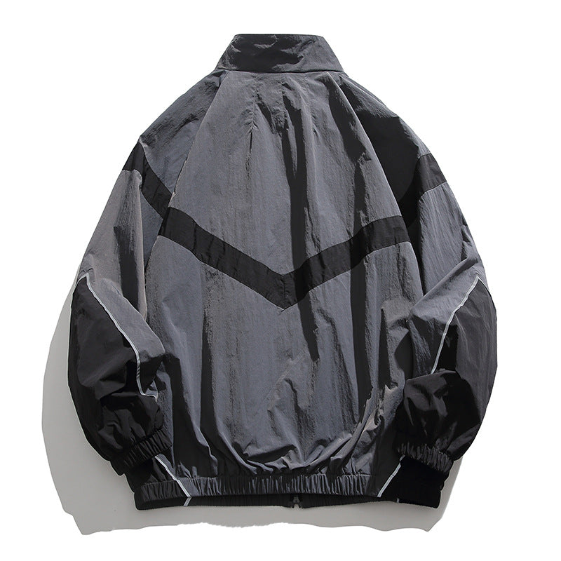 [Unisex] Oversize technische Wind- und Regenjacke mit Stehkragen, reflektierenden Paspeln und elastischem Saum Nord Taschen