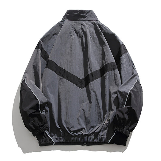 [Unisex] Oversize technische Wind- und Regenjacke mit Stehkragen, reflektierenden Paspeln und elastischem Saum Nord Taschen