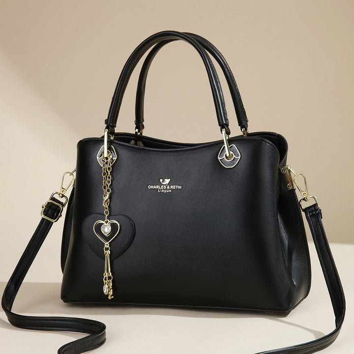Damen elegante Handtasche mit Herzanhänger Nord Taschen