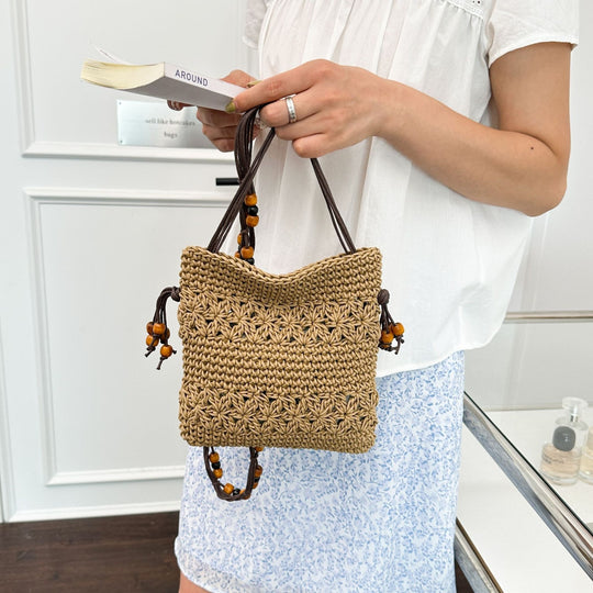 Damenhandtasche aus handgewebtem Naturmaterial mit verspielten Details Nord Taschen